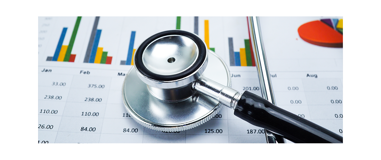 Stethoscope atop charts printed on paper