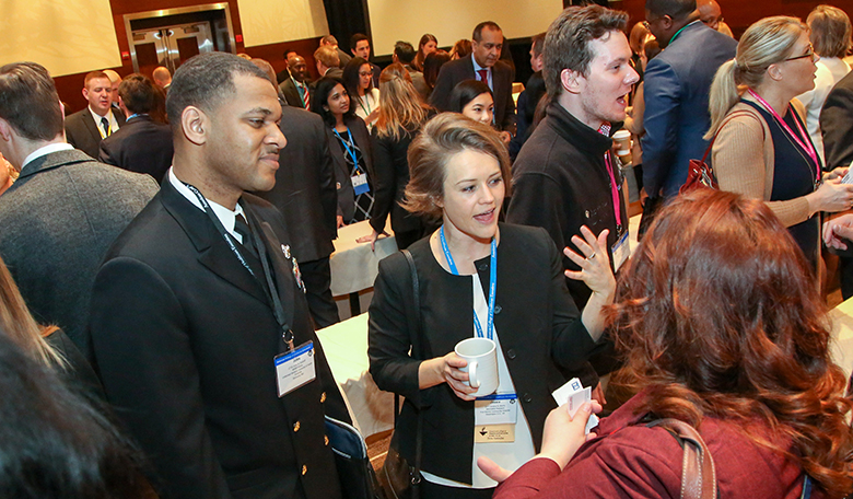 Woman and man engaged in conversation at an event