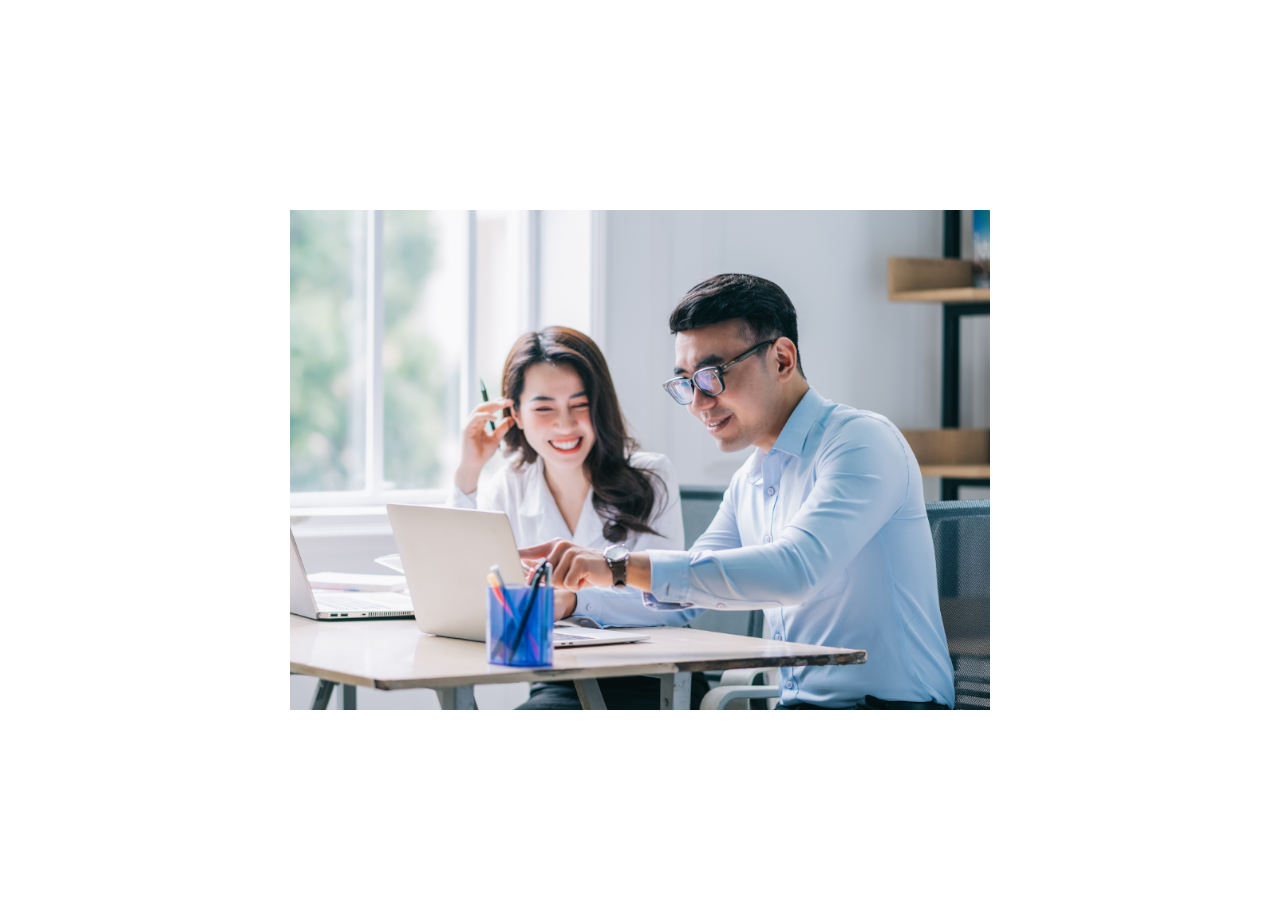 Two people looking at laptop